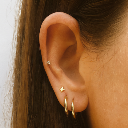 Tiny sparkle star studs - Gold